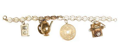 A 14 Karat Yellow Gold Charm Bracelet and Set of Charms, 19.90 dwts.