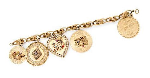 A 14 Karat Yellow Gold Charm Bracelet with Five Attached Charms, 33.40 dwts.