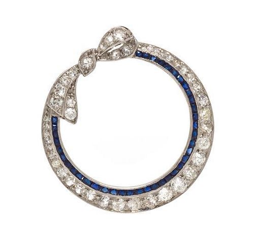 An Art Deco Platinum, Diamond and Synthetic Sapphire Brooch, Circa 1920, 3.80 dwts.