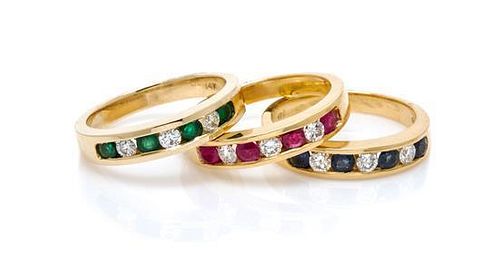 * A Collection of 14 Karat Yellow Gold, Emerald, Sapphire, Ruby and Diamond Rings, 7.30 dwts.