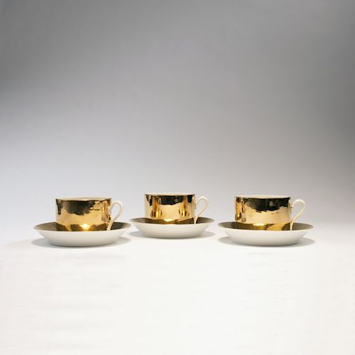 Piero Fornasetti, 3 'Oro' cups with saucers, 1950/60s