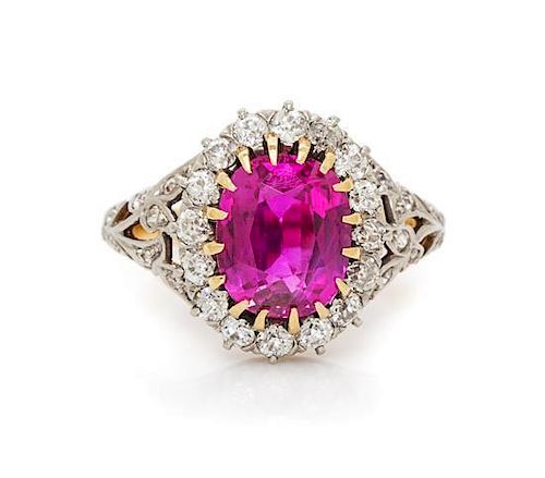 A Platinum, Yellow Gold, Ruby and Diamond Ring, 4.70 dwts.