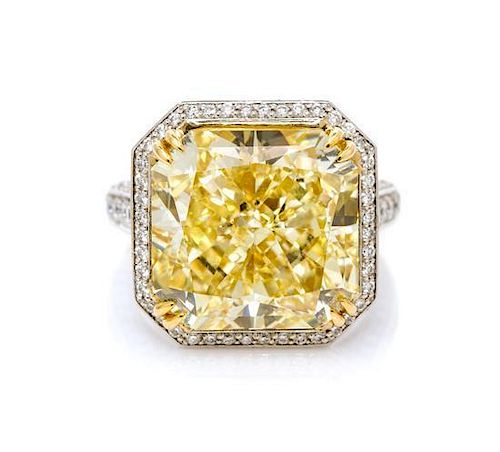* An Impressive Platinum, 18 Karat Yellow Gold, Fancy Yellow Diamond and Diamond Ring, 11.10 dwts.