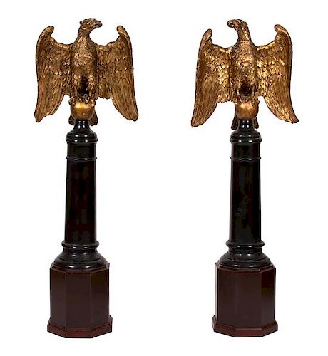 A Pair of Continental Giltwood Eagles on Later Stands Height overall 65 3/4 inches x width 19 x depth 7 inches.