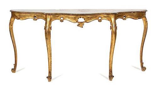 A Louis XV Style Carved Giltwood Serpentine Console Table Height 32 x width 65 inches.