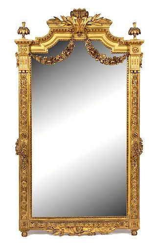 A Louis XVI Style Carved Giltwood Mirror Height 57 1/2 x width 45 1/2 inches.