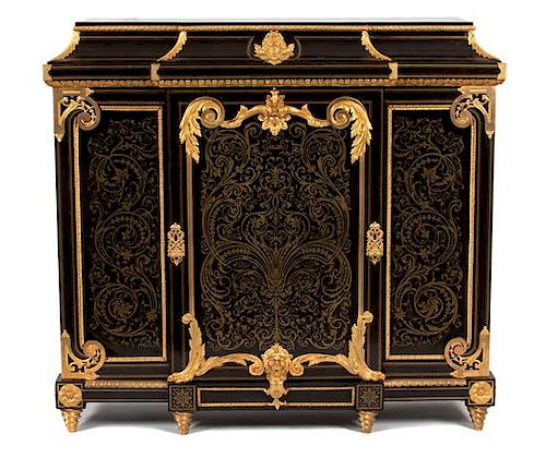 A Napoleon III Gilt Bronze Mounted and Cut Brass Inlaid Ebony Cabinet Height 52 x width 55 x depth 17 inches.