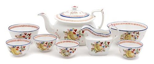 An English Porcelain Partial Dessert Service Height of teapot 6 inches.