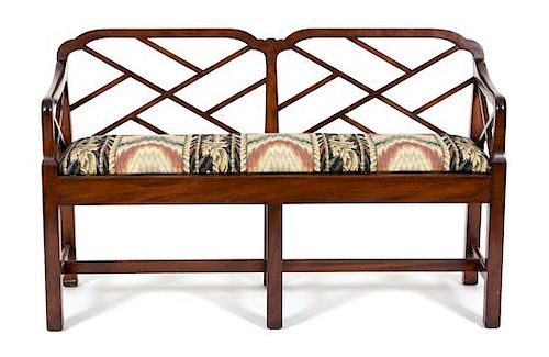 A Chinese Chippendale Style Mahogany Bench Height 30 1/2 x width 49 x depth 17 inches.