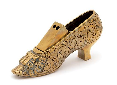 An English Brass Lady's Shoe-Form Cigar Cutter Height 4 1/2 x width 2 1/2 x depth 8 1/2 inches.