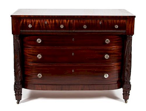 An American Empire Figured Mahogany Chest of Drawers Height 36 1/2 x width 48 x depth 24 inches.