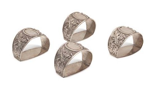 A Set of Four Scottish Silver Napkin Rings, George & John Morgan, Glasgow, 1900, retailed by Alfred Dunhill, in fitted case