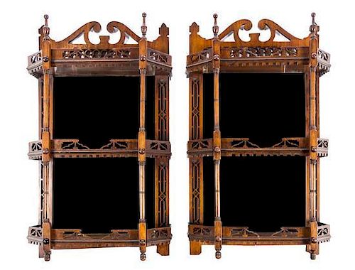 A Pair of Chippendale Style Mahogany Hanging Etageres Height 28 x width 15 1/2 x depth 7 1/4 inches.