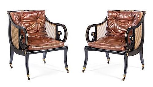 A Pair of Regency Ebonized and Parcel Gilt Library Chairs Height 37 inches.