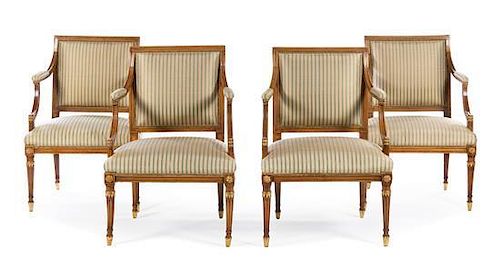 A Set of Four Swedish Parcel Gilt Beechwood Arm Chairs Height 35 inches.