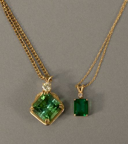 Two 14 karat pendants, each set with green stone, one also set with diamond, one on 14 karat gold chain.
