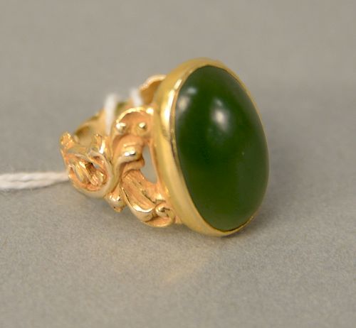 14 karat gold ring, set with cabochon cut green jadeite. size 7, 8.5 grams