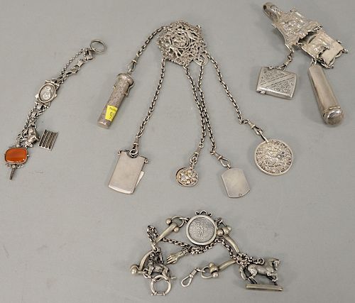 Group of four silver Chatelaine, one with cigar tip holder with gold rim.