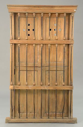 Continental shutters behind bars, probably 19th century. ht. 76 in., wd. 44 in.