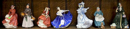 Group of seven Royal Doulton figures including Christmas Parcels, Flowers of Love signed, Elaine, The Favourite, The Orange Lady, To...