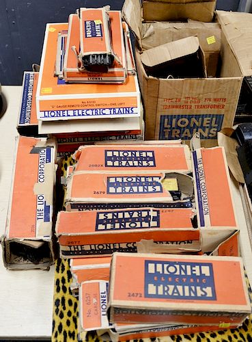 Full Lionel train set in original boxes to include two engines, coal car, nine cares, train tracks, trainmaster transformer and mult...