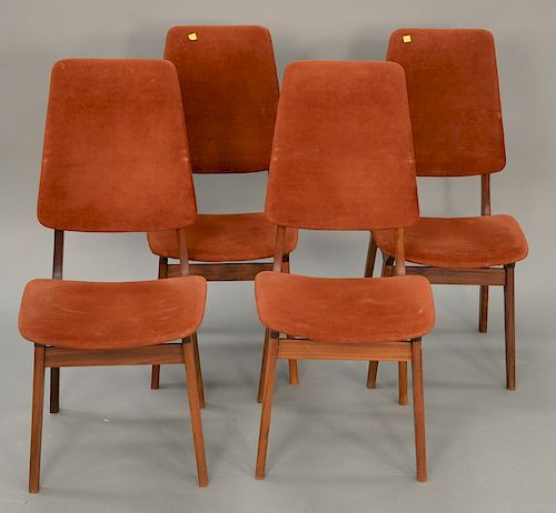Four teak Kofod Larsen dining chairs.