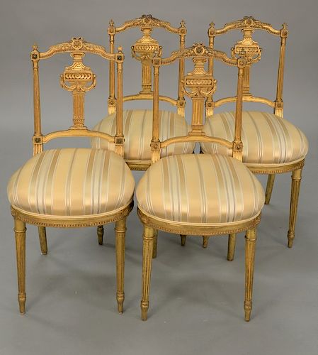 Set of four gilt Louis XVI style side chairs.
