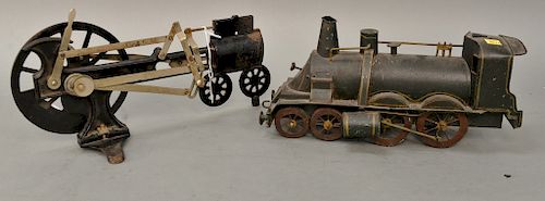 Group lot to include painted tin toy train, an iron mechanical locomotive, and Peter Rabbit Chick Mobile by Lionel (as is). lg. 14 1/2'' - 15''