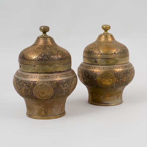 Pair of Qajar Pierced Brass Urn Form Jars and Covers