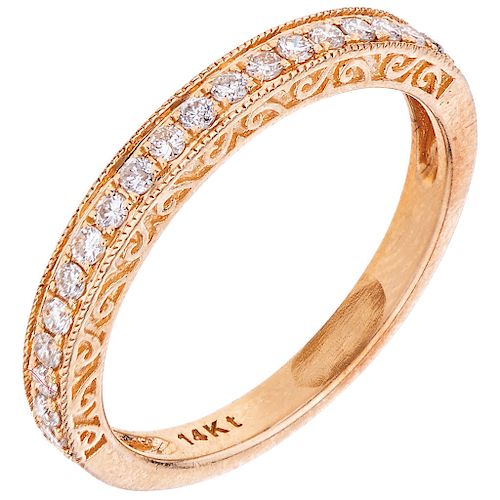 A diamond 14K yellow gold eternity ring.