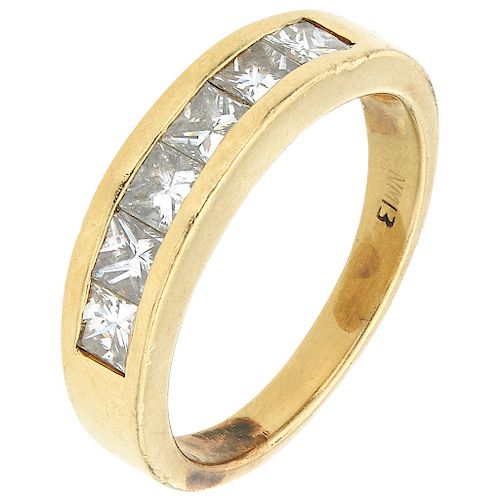 A diamond 14K yellow gold half eternity ring. 