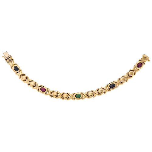 An emerald, sapphire and ruby 18K yellow gold bracelet.