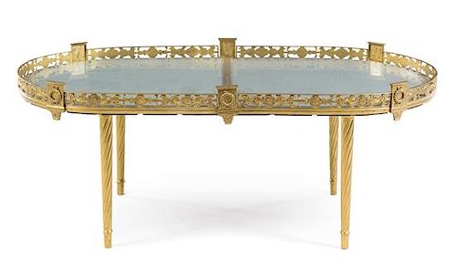 An Empire Style Gilt Metal Low Table Height 17 7/8 x width 44 3/4 x depth 24 3/4 inches.