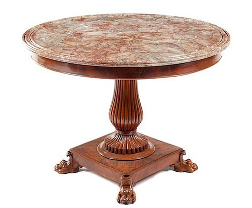 A Charles X Mahogany Center Table Height 30 1/2 x diameter of top 41 inches.