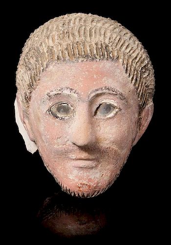 * A Romano-Egyptian Plaster Mummy Mask Height 9 1/2 inches.