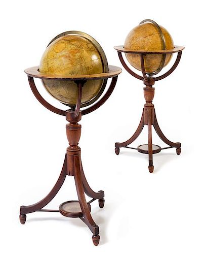 A Pair of Regency Mahogany Twelve-Inch Library Globes Height 35 inches.