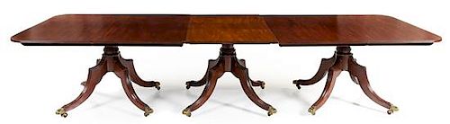 An Irish Regency Mahogany Convertible Dining Table Height 29 x width 49 1/2 x length 181 1/4 inches (fully extended).