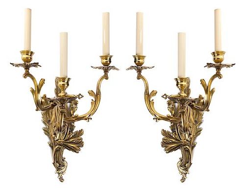 A Pair of Louis XV Style Gilt Bronze Three-Light Sconces Height overall 22 1/2 inches.