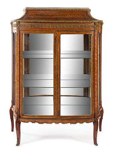 A Louis XV/XVI Transitional Style Marquetry Vitrine Cabinet Height 57 1/2 x width 43 x depth 17 inches.