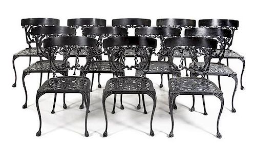 A Set of Twelve Painted Cast Iron Garden Chairs Height 30 inches.