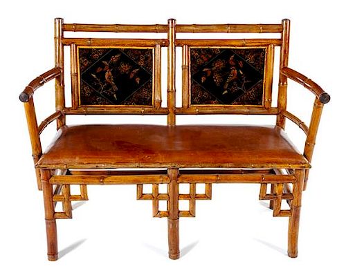 An English Victorian Bamboo Settee Height 37 3/4 x width 48 1/4 x depth 19 inches.