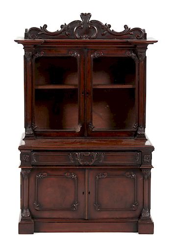 A Victorian Diminutive Carved Mahogany Step-Back Cabinet