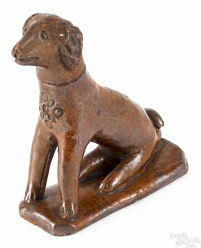 Pennsylvania redware seated spaniel, 19th c., probably Berks County, with a manganese glaze