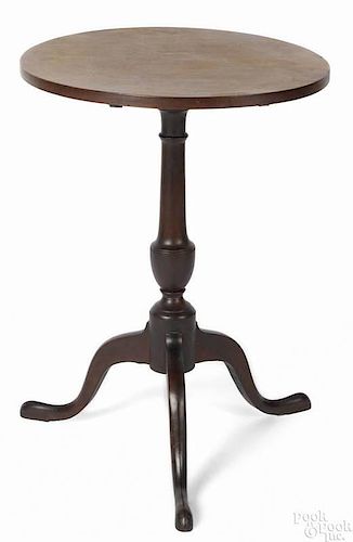 New England mahogany candlestand, late 18th c., with an oblong tilting top and urn turned standard