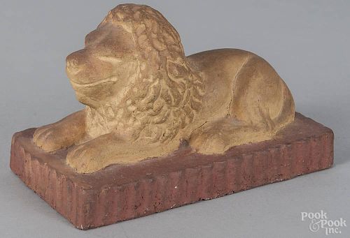 Sewer tile of a recumbent lion, 20th c., inscribed on underside top fire clay base shale
