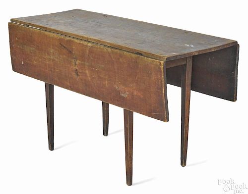 New England pine dropleaf work table, ca. 1820, retaining an old red surface, 27'' h., 47 3/4'' w.