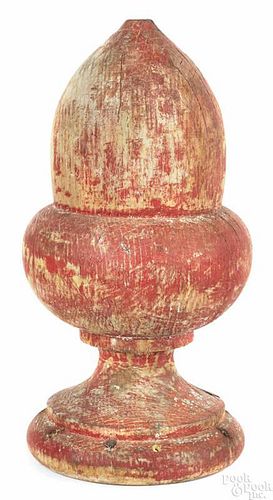 Turned and painted acorn architectural element, 19th c., retaining an old, weathered red surface