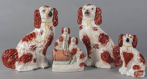 Four English Staffordshire spaniels, 19th c., to include a large pair, 12 1/2'' h.
