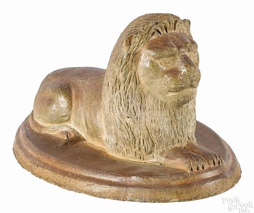 Sewer tile recumbent lion, late 19th c., probably Ohio, 8'' h., 15'' w. Provenance: R. H. Wood.