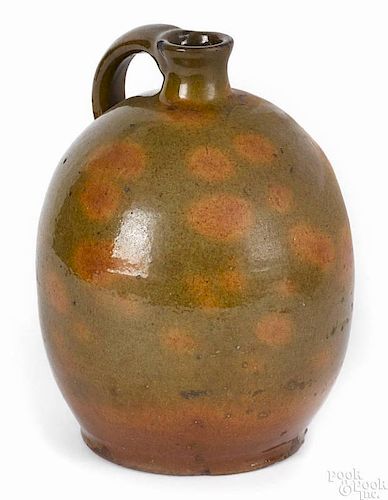 New Hampshire redware jug, early 19th c., Gonic type, with mottled orange and green glaze